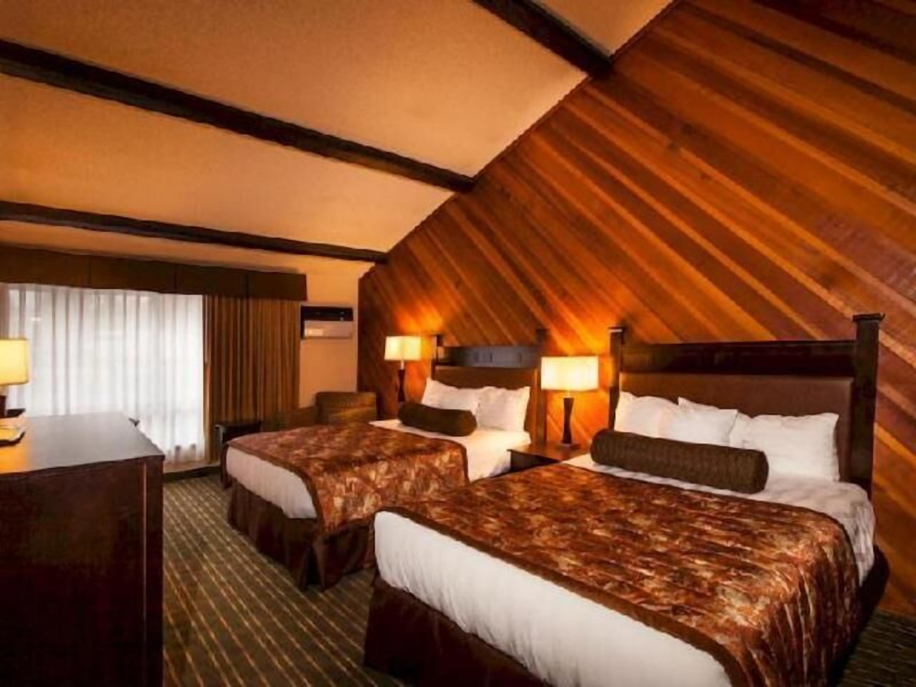 Premium bedding, pillow-top beds, desk, laptop workspace