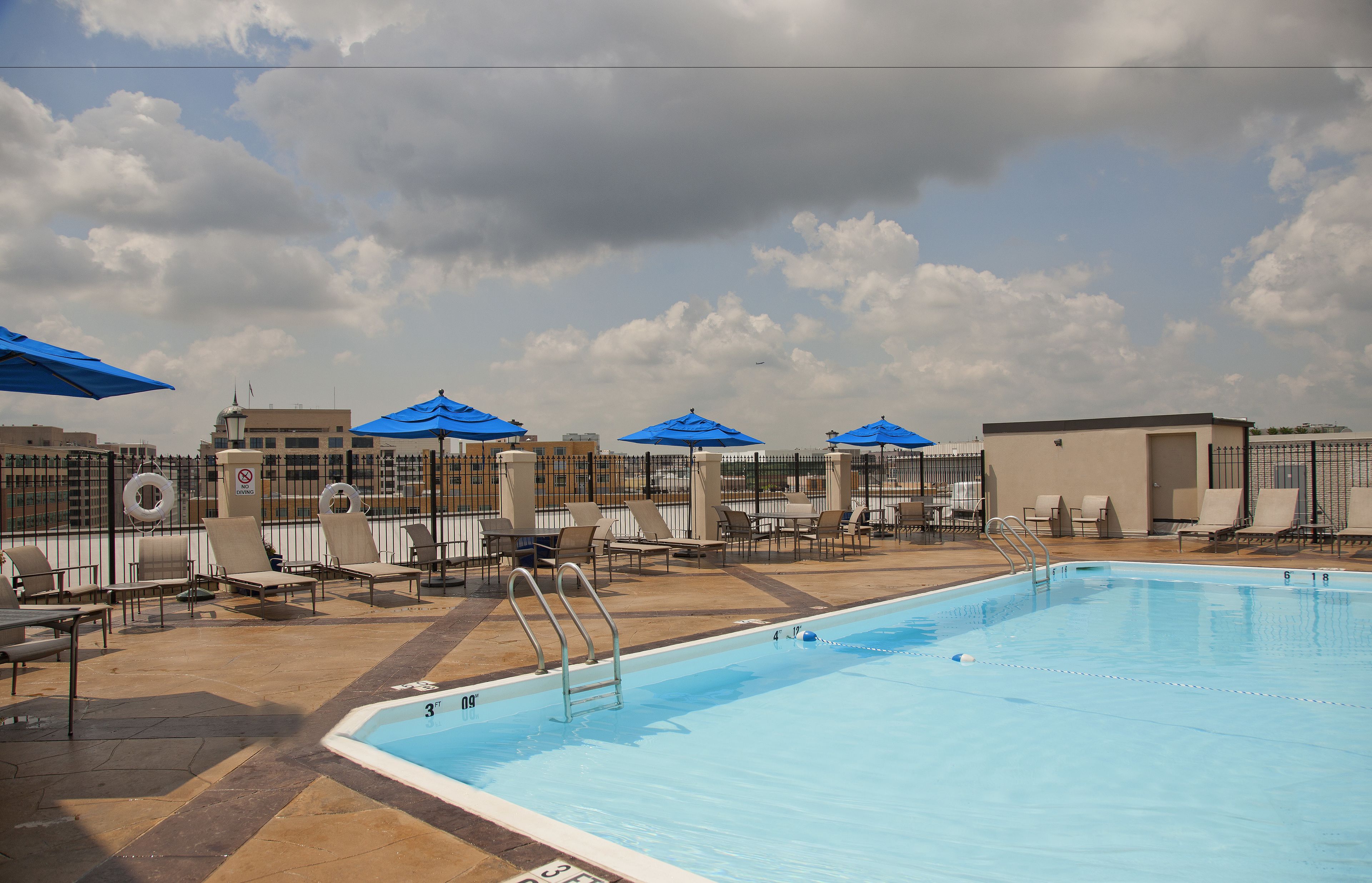seasonal outdoor pool, open 10:00 am to 8:00 pm, pool loungers