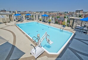 Seasonal outdoor pool, open 10:00 AM to 8:00 PM, pool loungers