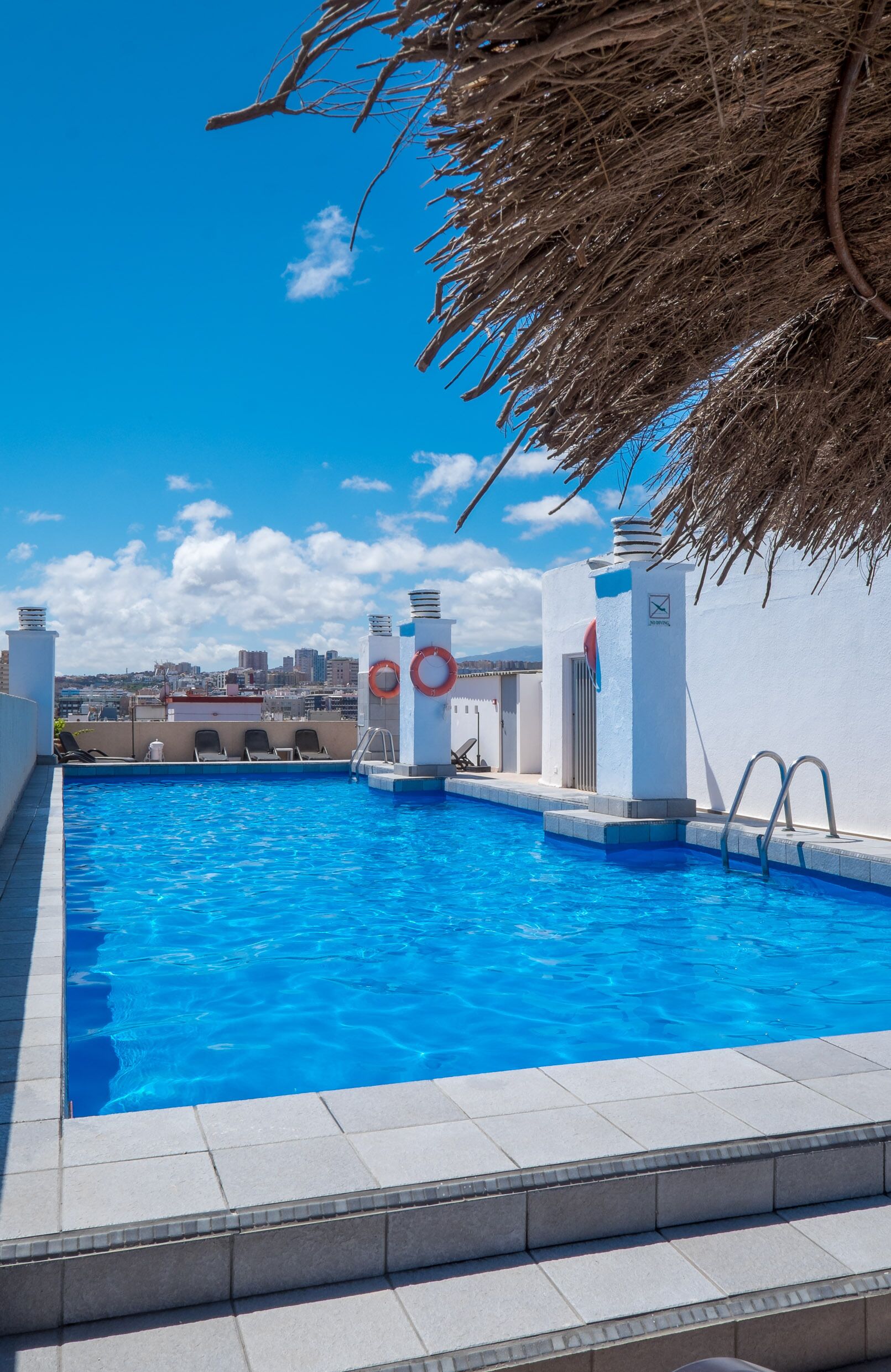 Outdoor pool, open 9:00 AM to 7:00 PM, pool umbrellas, pool loungers