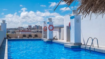 Outdoor pool, open 9:00 AM to 7:00 PM, pool umbrellas, pool loungers