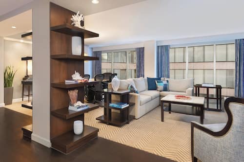 Business Suite, 1 Queen Bed, City View, Corner | Living room | 49-inch flat-screen TV with premium TV channels, TV, iPod dock