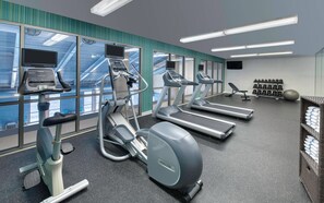 A modern gym with treadmills, an elliptical, and a rowing machine. - Holiday Inn Express & Suites Mississauga-Toronto Southwest by IHG (Mississauga)