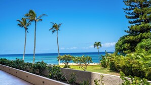 A coastal view with palm trees and a clear sky. - Royal Kahana Maui by OUTRIGGER (Lahaina)