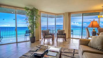 Condo, 2 Bedrooms, 2 Bathrooms, Oceanfront (Unit 1110) | Living area | 65-inch Smart TV with cable channels