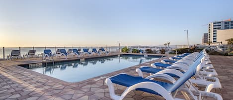 Indoor pool, pool umbrellas, pool loungers