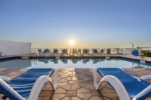 Indoor pool, outdoor pool, open 7:00 AM to 11:00 PM, pool umbrellas
