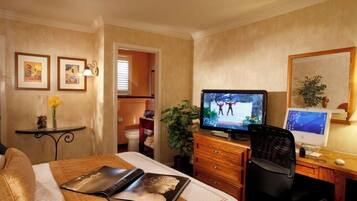 Desk, laptop workspace, iron/ironing board, free cribs/infant beds