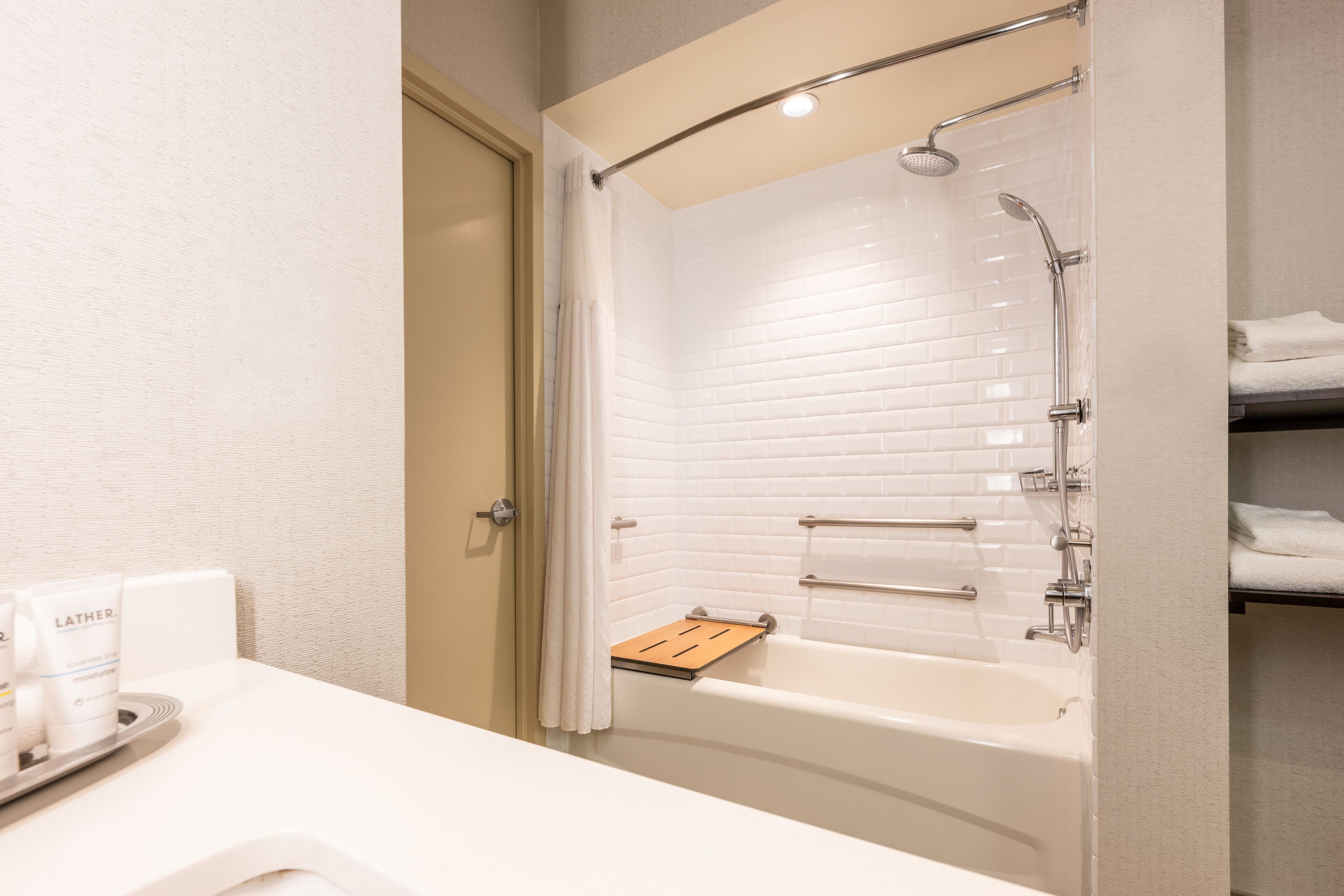 combined shower/bathtub, rainfall showerhead, designer toiletries