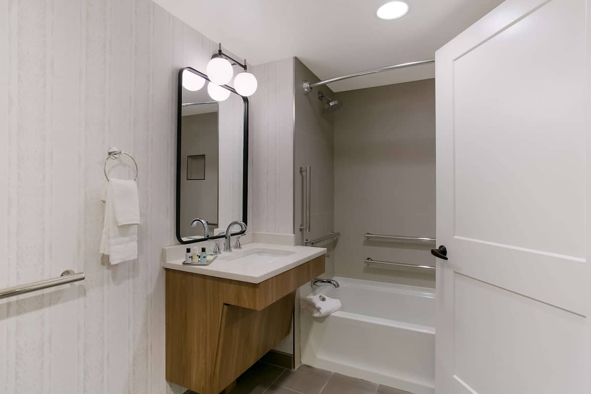 standard room, 2 queen beds, accessible, poolside | bathroom | free toiletries, hair dryer, towels