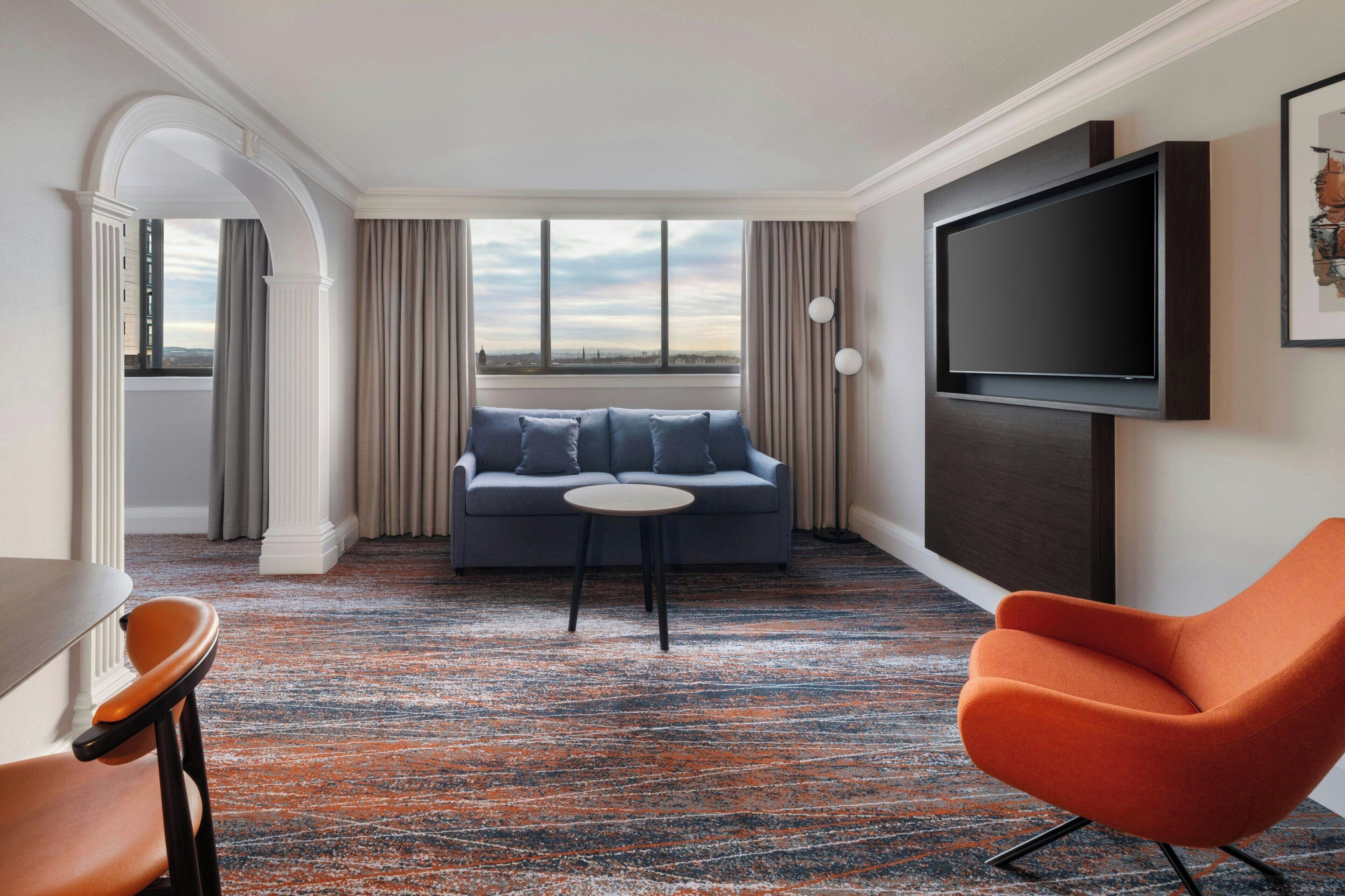 junior suite, 1 king bed | living room | 49-inch flat-screen tv with satellite channels, led tv