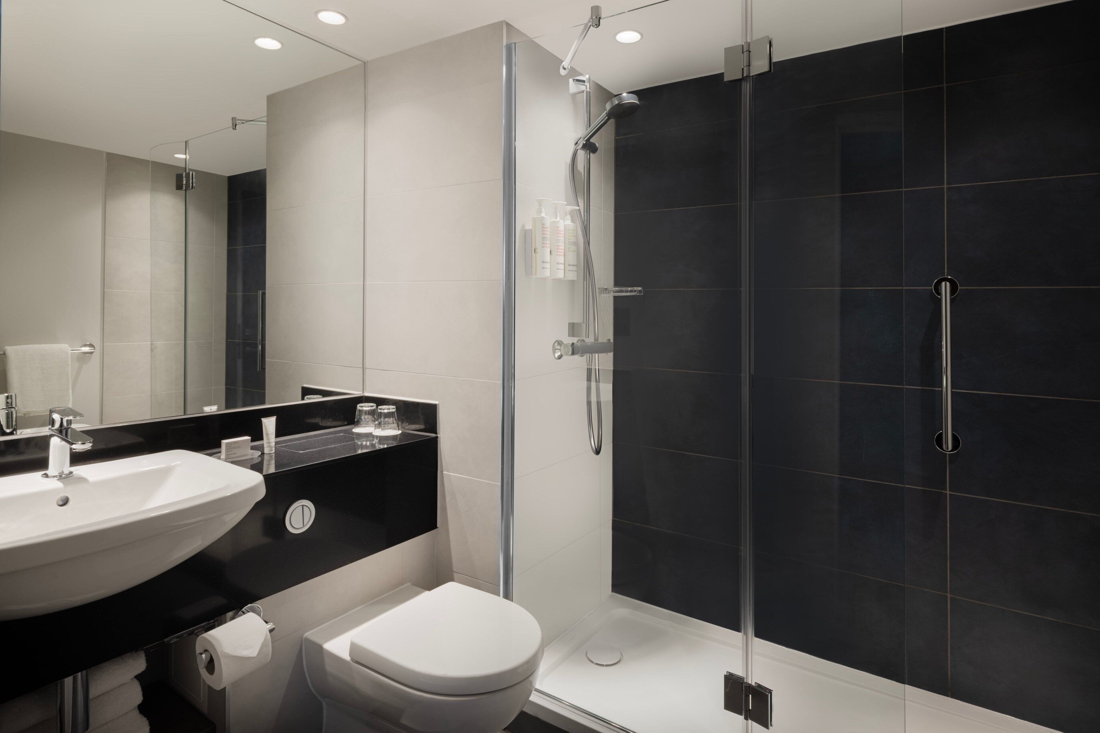 combined shower/bathtub, deep-soaking bathtub, designer toiletries