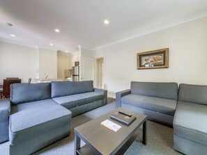 Deluxe Two Bedroom Apartment. No ground floor rooms available for this room type | Living area | 32-inch LCD TV with cable channels, TV