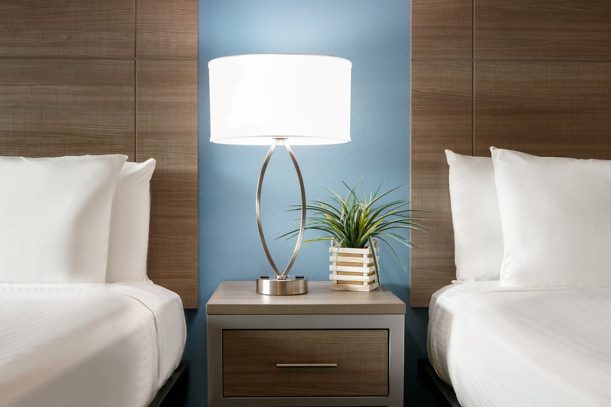Signature Room | Premium bedding, pillow-top beds, desk, blackout curtains