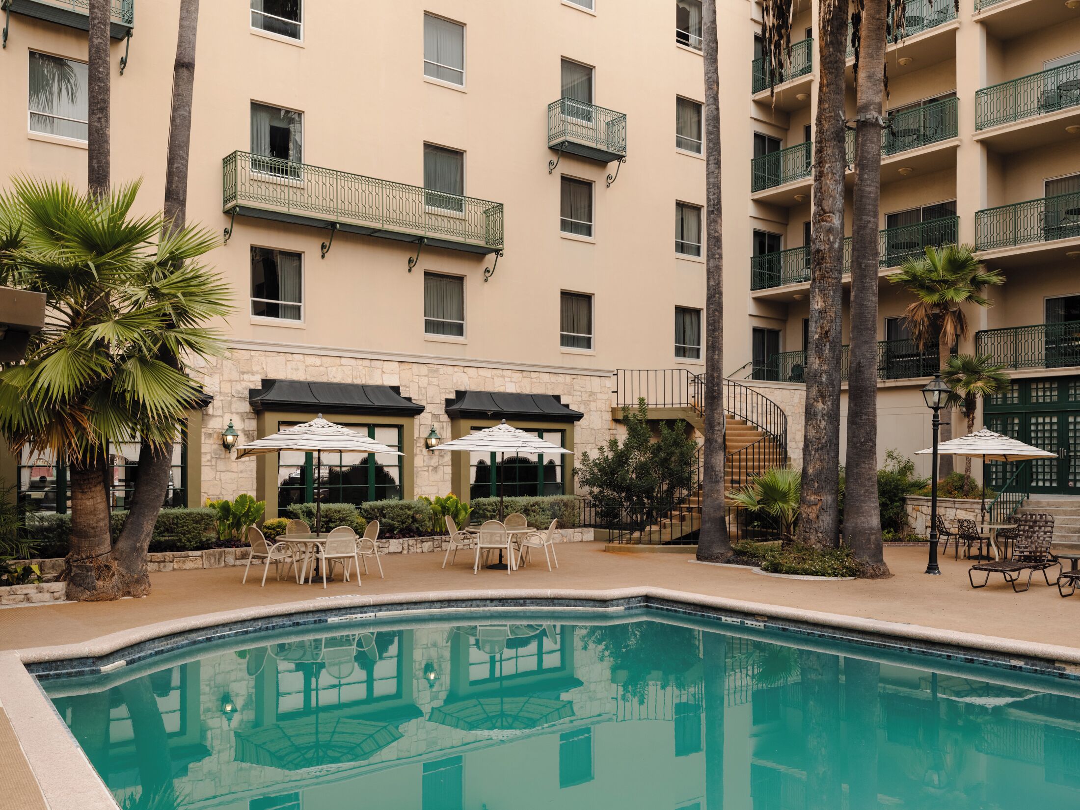 Outdoor pool, open 9:00 AM to 10:00 PM, pool umbrellas, pool loungers