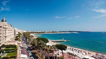 On the beach, sun-loungers, beach umbrellas, beach towels