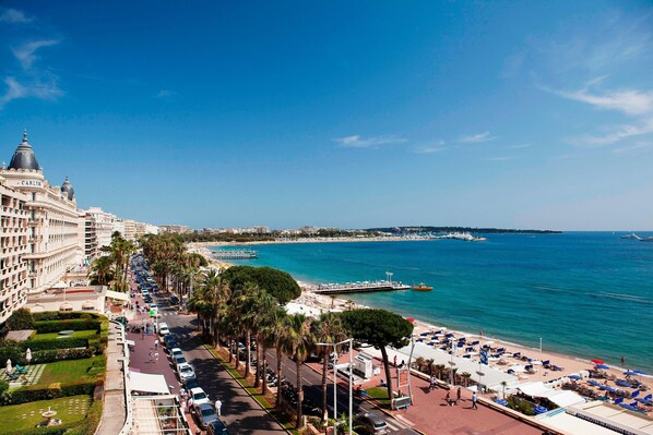 On the beach, sun-loungers, beach umbrellas, beach towels
