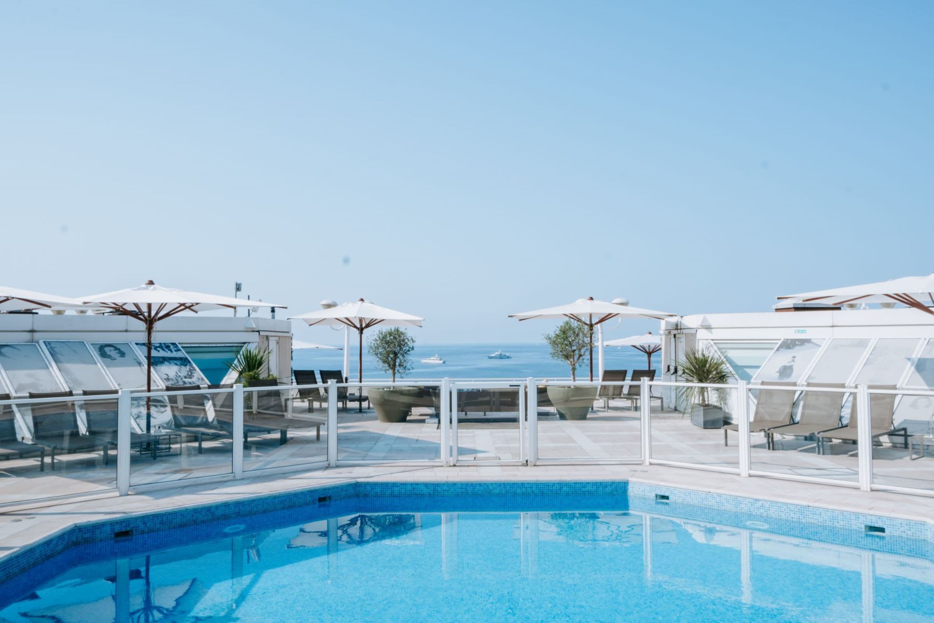 outdoor pool, pool umbrellas, pool loungers