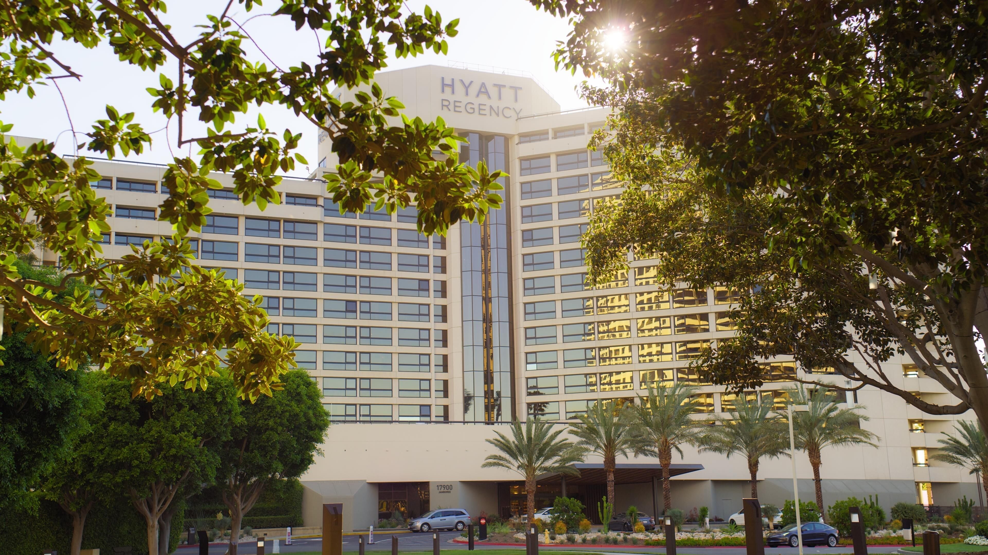 A multi-story building with a sign reading 'HYATT REGENCY.'