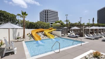 Outdoor pool, open 7:00 AM to 10:00 PM, cabanas (surcharge)