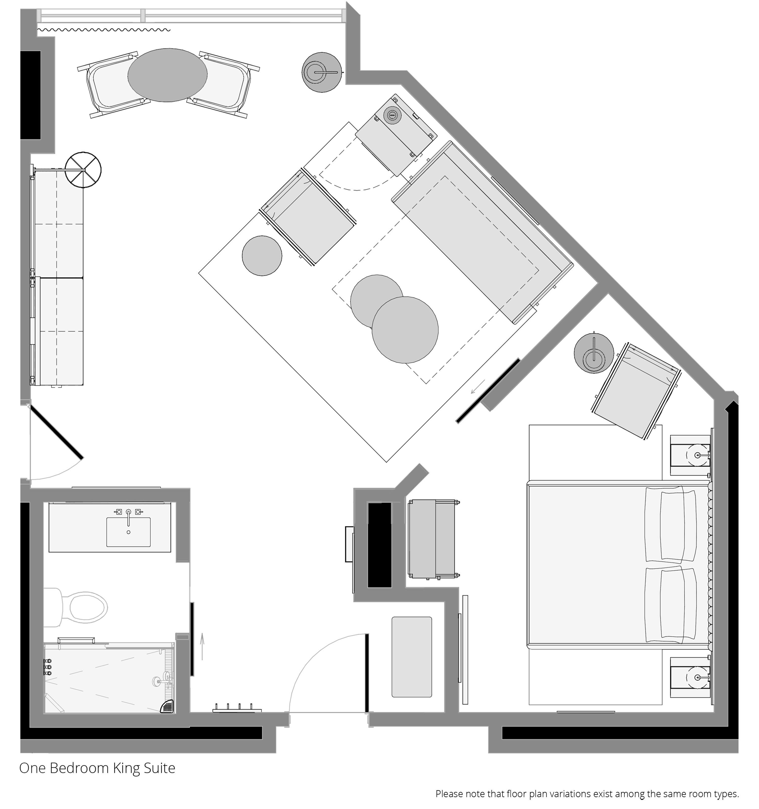 A floor plan of a one-bedroom king suite with a bathroom, kitchen, and living area.