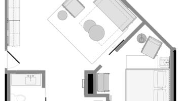 A floor plan of a one-bedroom king suite with a bathroom, kitchen, and living area.