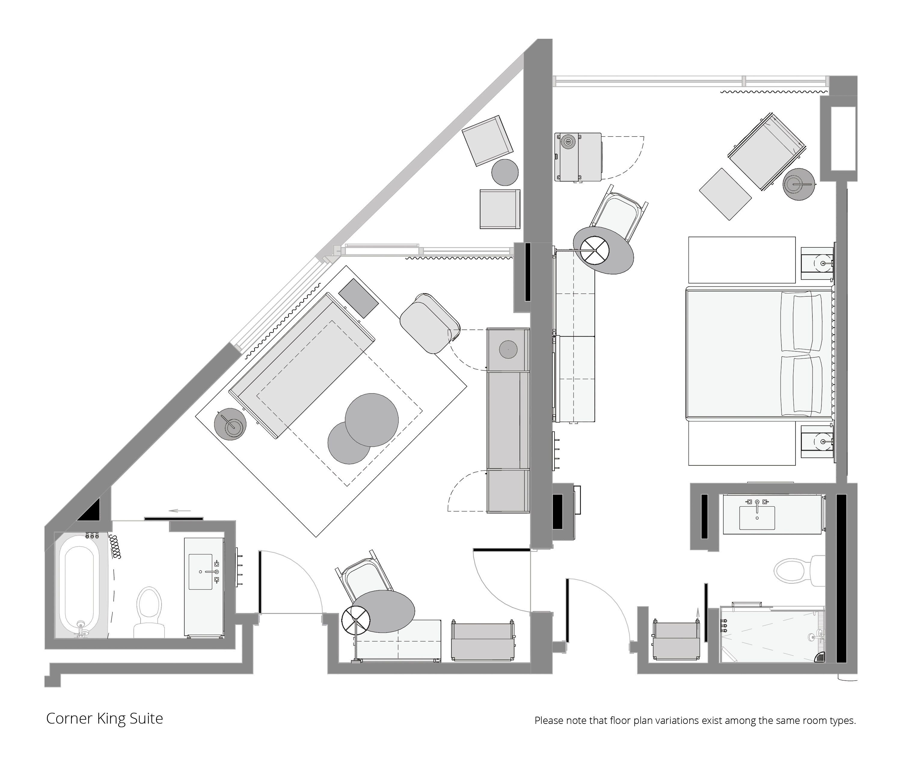 Plan d’étage d’une suite d’angle « King » comprenant une salle de bain, un espace de vie avec un canapé et une télévision, un coin repas et une chambre à coucher.