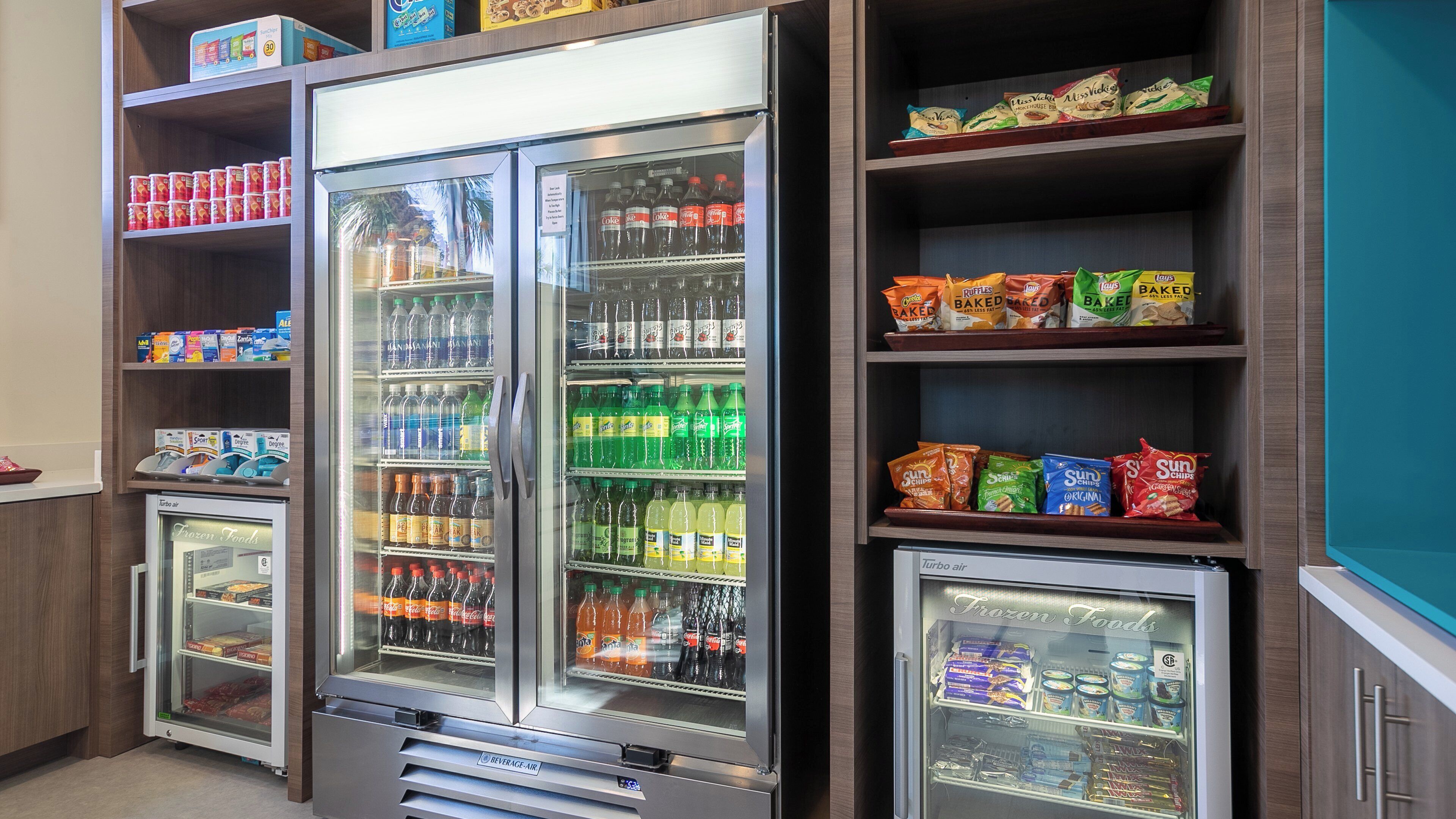 A beverage vending machine with a variety of drinks and snacks.