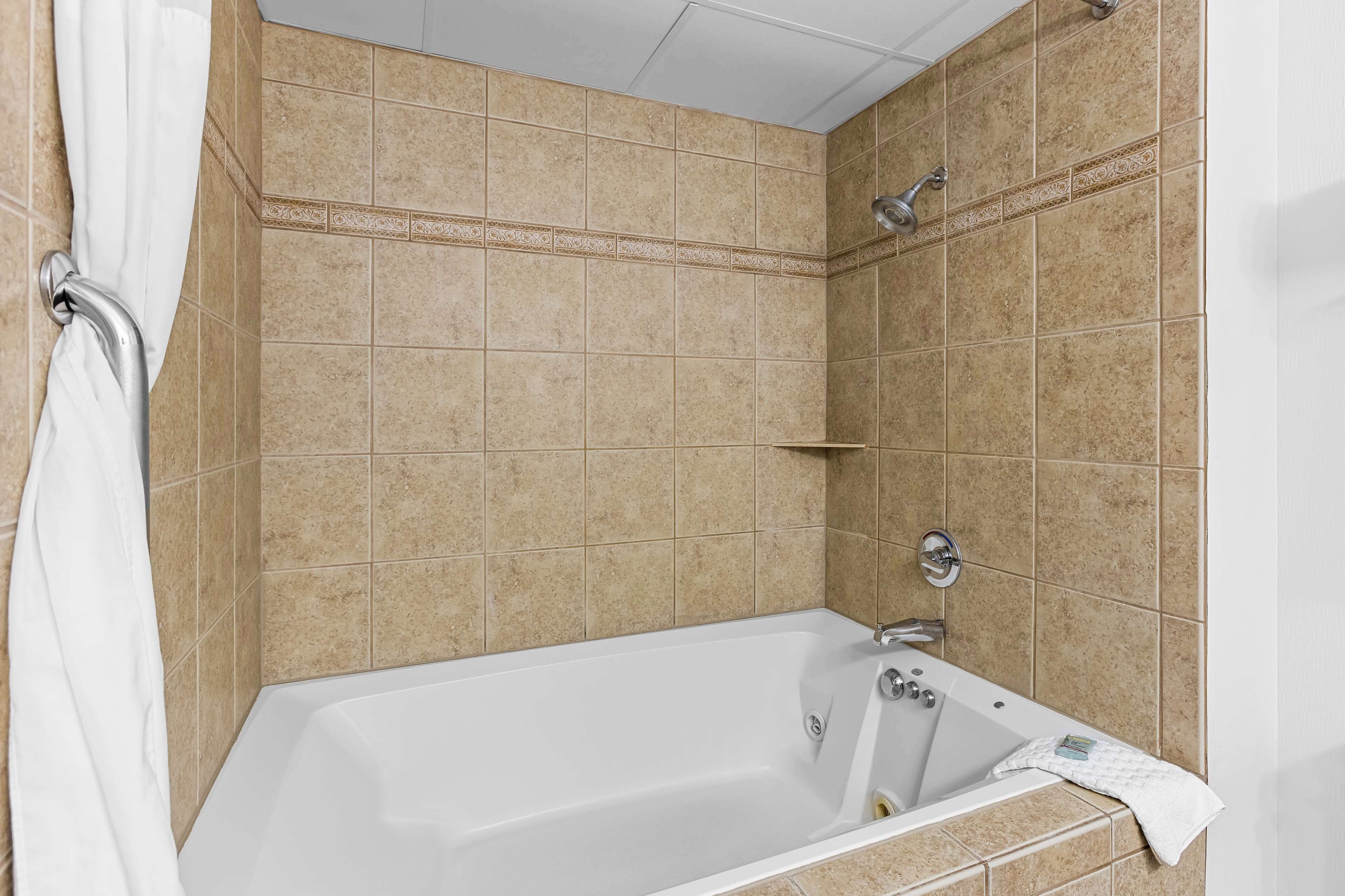 combined shower/bathtub, eco-friendly toiletries, hair dryer, towels