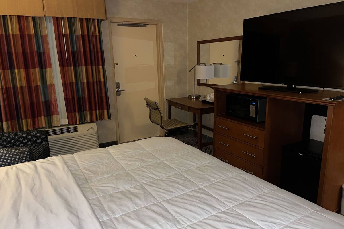 Premium bedding, desk, blackout curtains, iron/ironing board