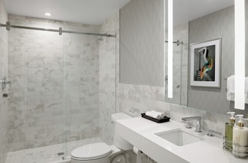 Combined shower/tub, designer toiletries, hair dryer, bathrobes at  Le Parc at Melrose