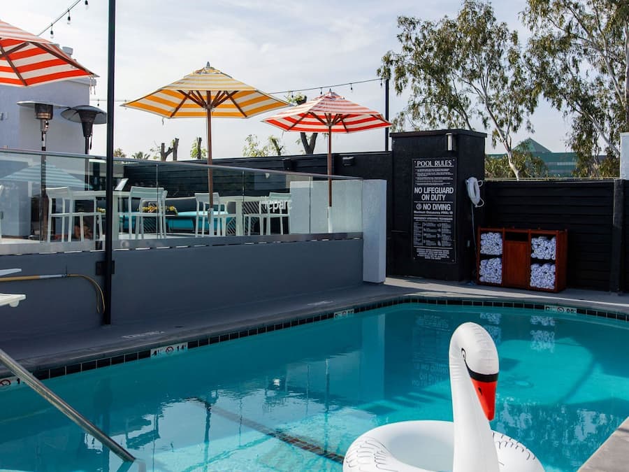 Outdoor pool, open 7 AM to 11 PM, cabanas (surcharge), pool umbrellas