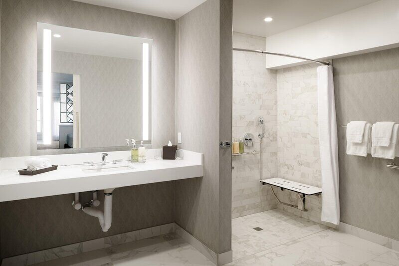 Combined shower/bathtub, designer toiletries, hair dryer, bathrobes