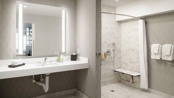Combined shower/bathtub, designer toiletries, hair dryer, bathrobes