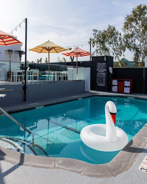 Outdoor pool, open 7 AM to 11 PM, pool cabanas (surcharge)