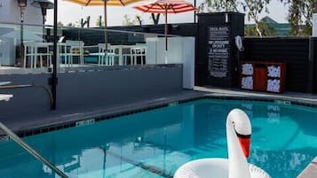 Outdoor pool, open 7 AM to 11 PM, cabanas (surcharge), pool umbrellas