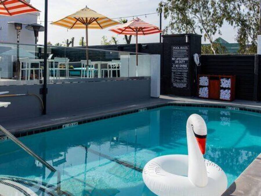 Outdoor pool, open 7 AM to 11 PM, cabanas (surcharge), pool umbrellas