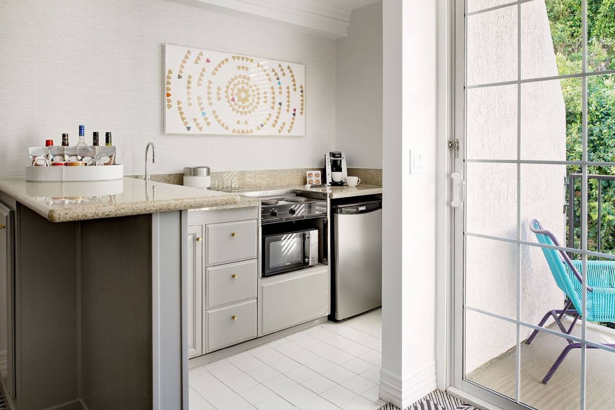 signature suite, 1 king bed with sofa bed, balcony (top floor) | private kitchen | fridge, microwave, coffee/tea maker, cookware/dishes/utensils