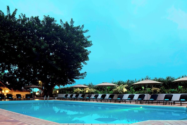 Outdoor pool, open 7:00 AM to 9:30 PM, pool umbrellas, pool loungers