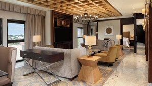 A spacious hotel lobby with a modern design, featuring a sofa set, a wooden coffee table, and a large chandelier. - Sheraton Lagos Hotel (Lagos)