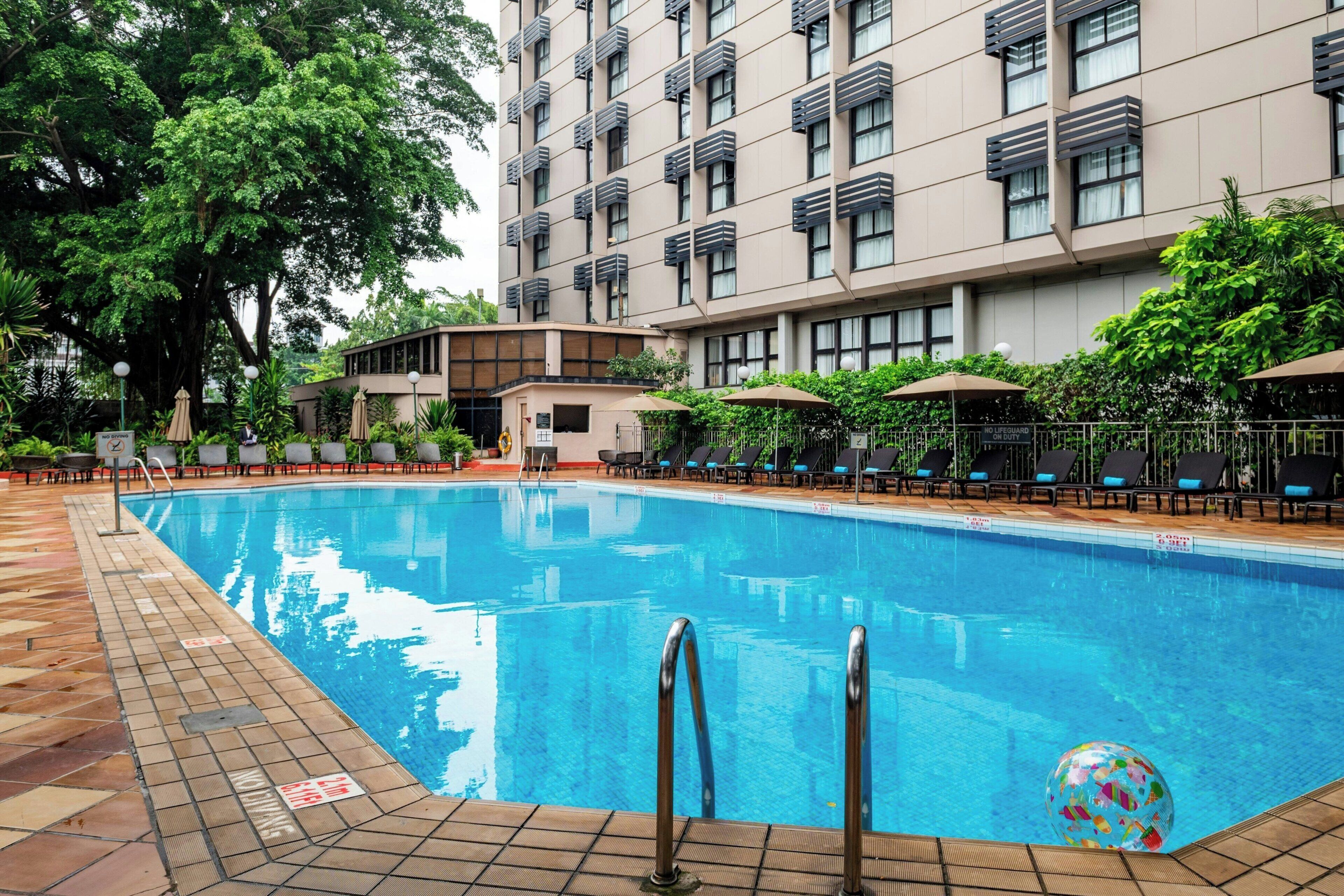 Outdoor pool, open 7:00 AM to 9:30 PM, pool umbrellas, pool loungers
