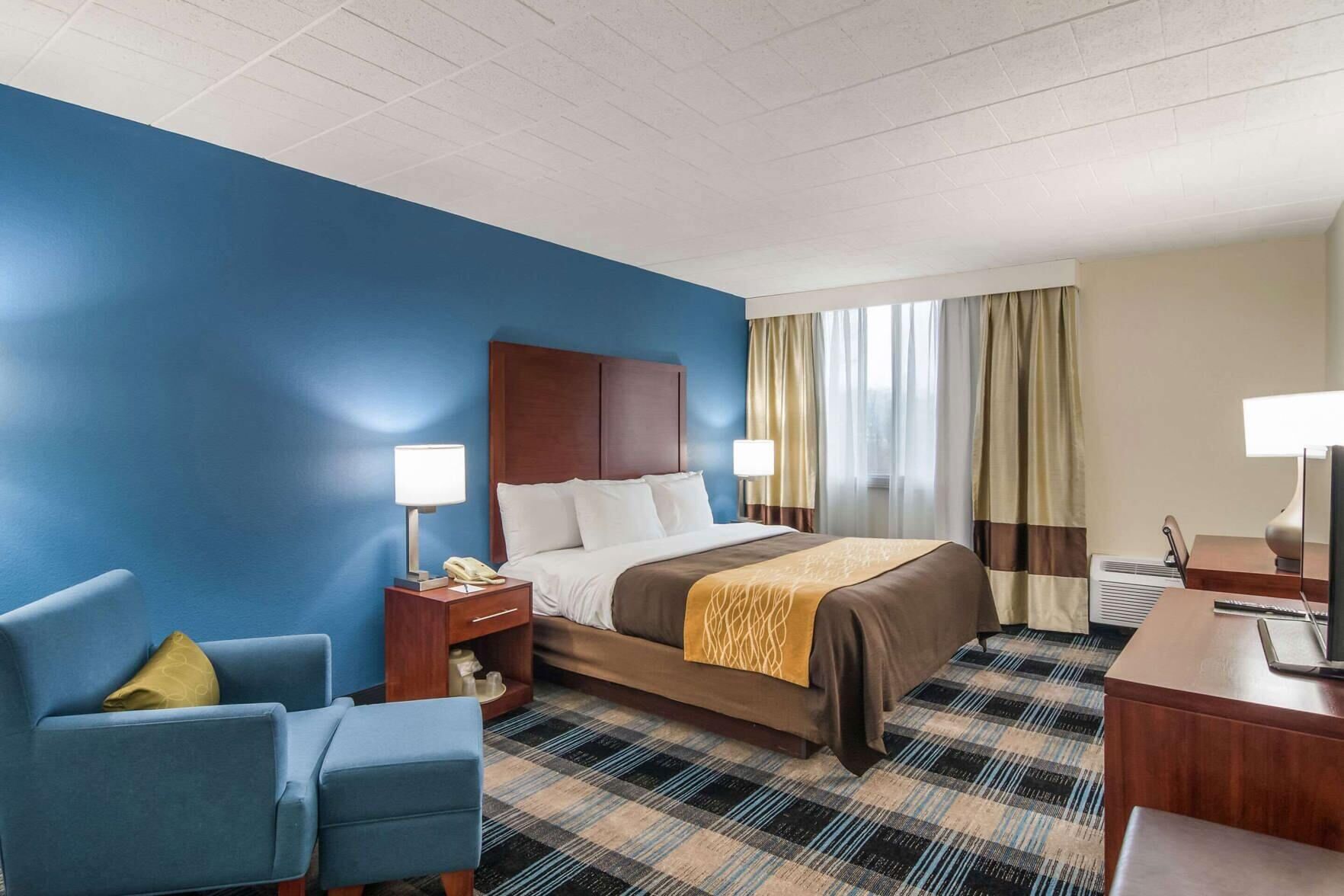 Premium bedding, desk, laptop workspace, blackout curtains