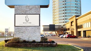 A Radisson hotel sign with a logo for Salt+Ko dining, events, and catering.