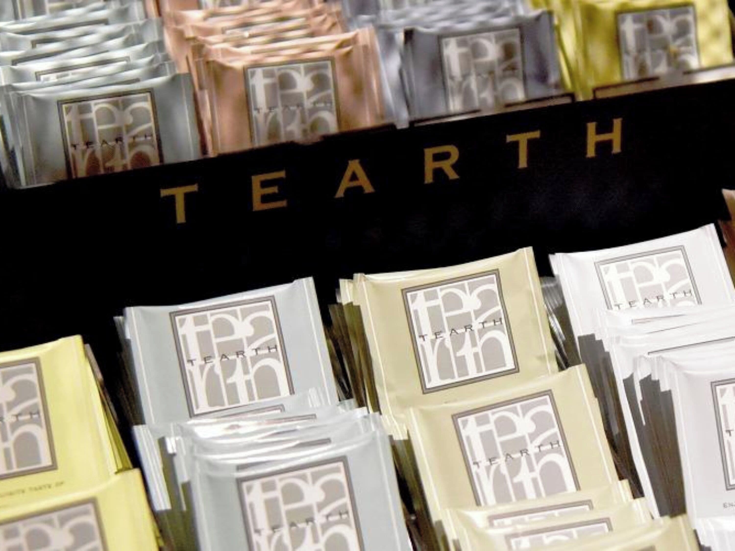 A display of various packaged items with the word "TEARTH" visible on a black background.