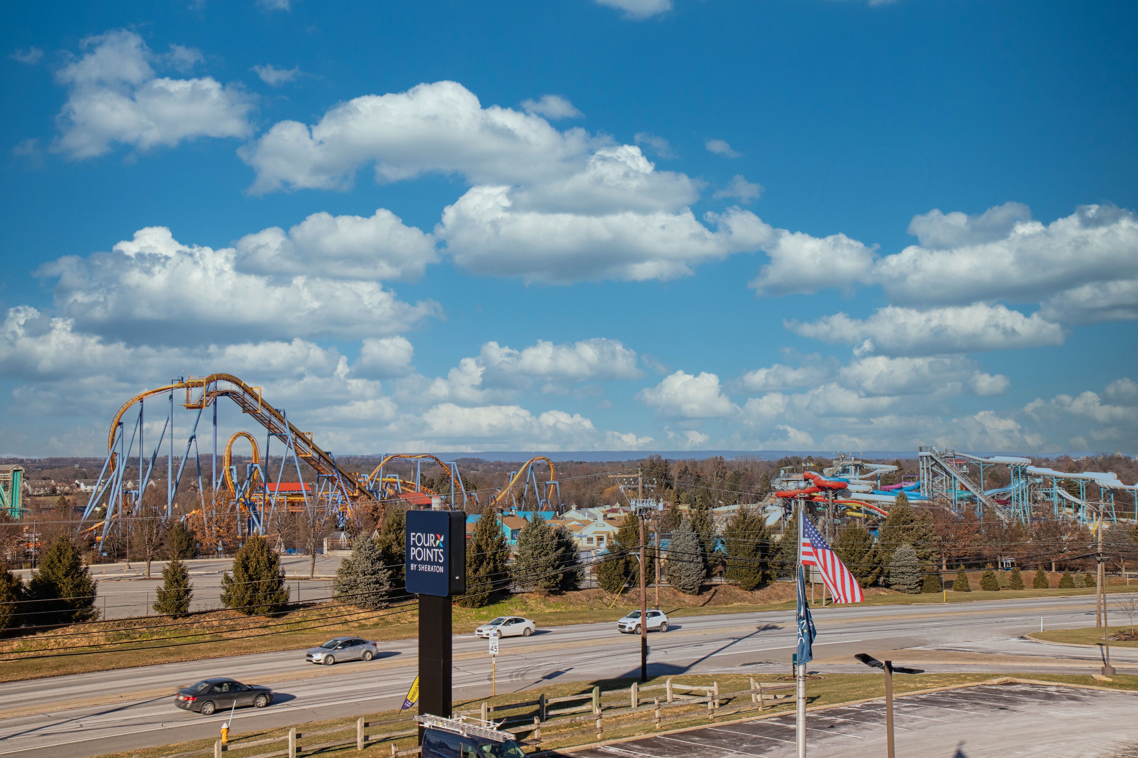 A roller coaster with a sign reading "Four Points of Salem."