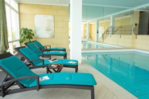 Indoor pool, open 7:00 AM to 10:00 PM, pool umbrellas, sun loungers