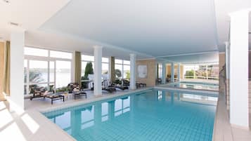 Indoor pool, open 7:00 AM to 10:00 PM, pool umbrellas, sun loungers