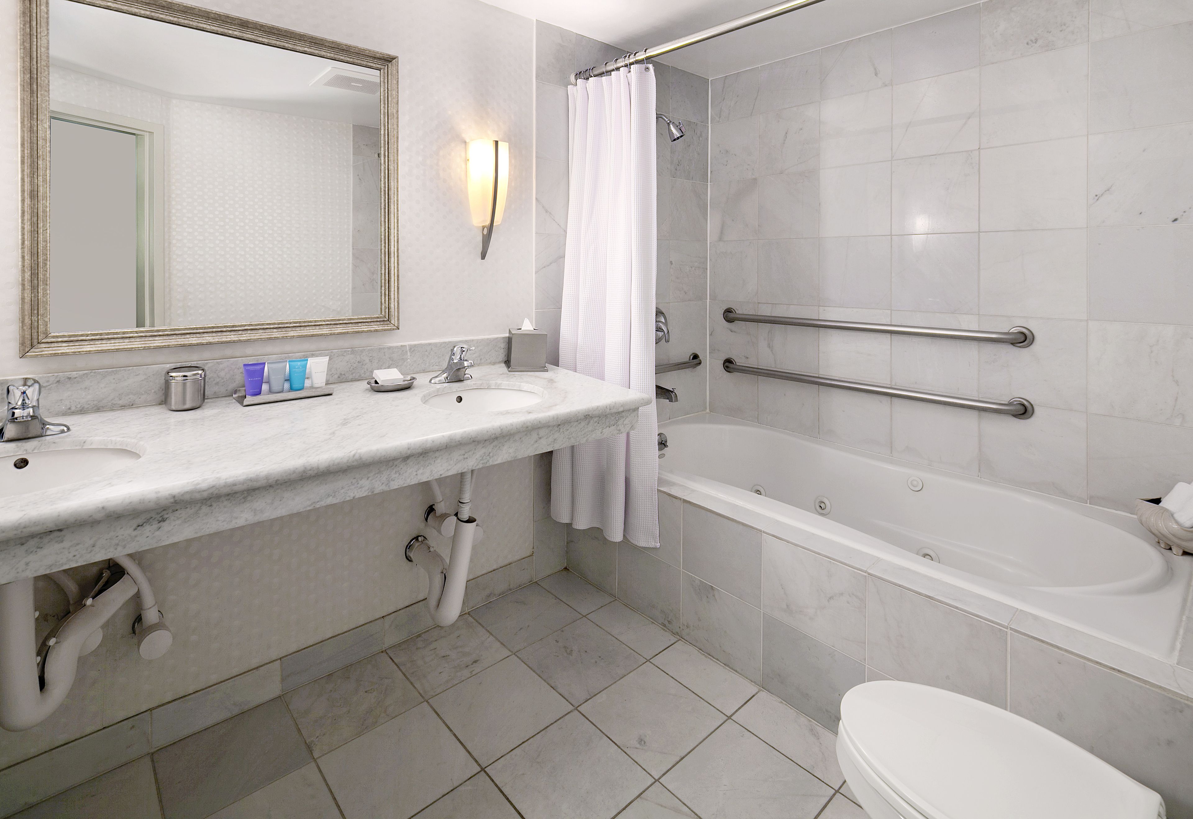 combined shower/bathtub, eco-friendly toiletries, hair dryer, bathrobes
