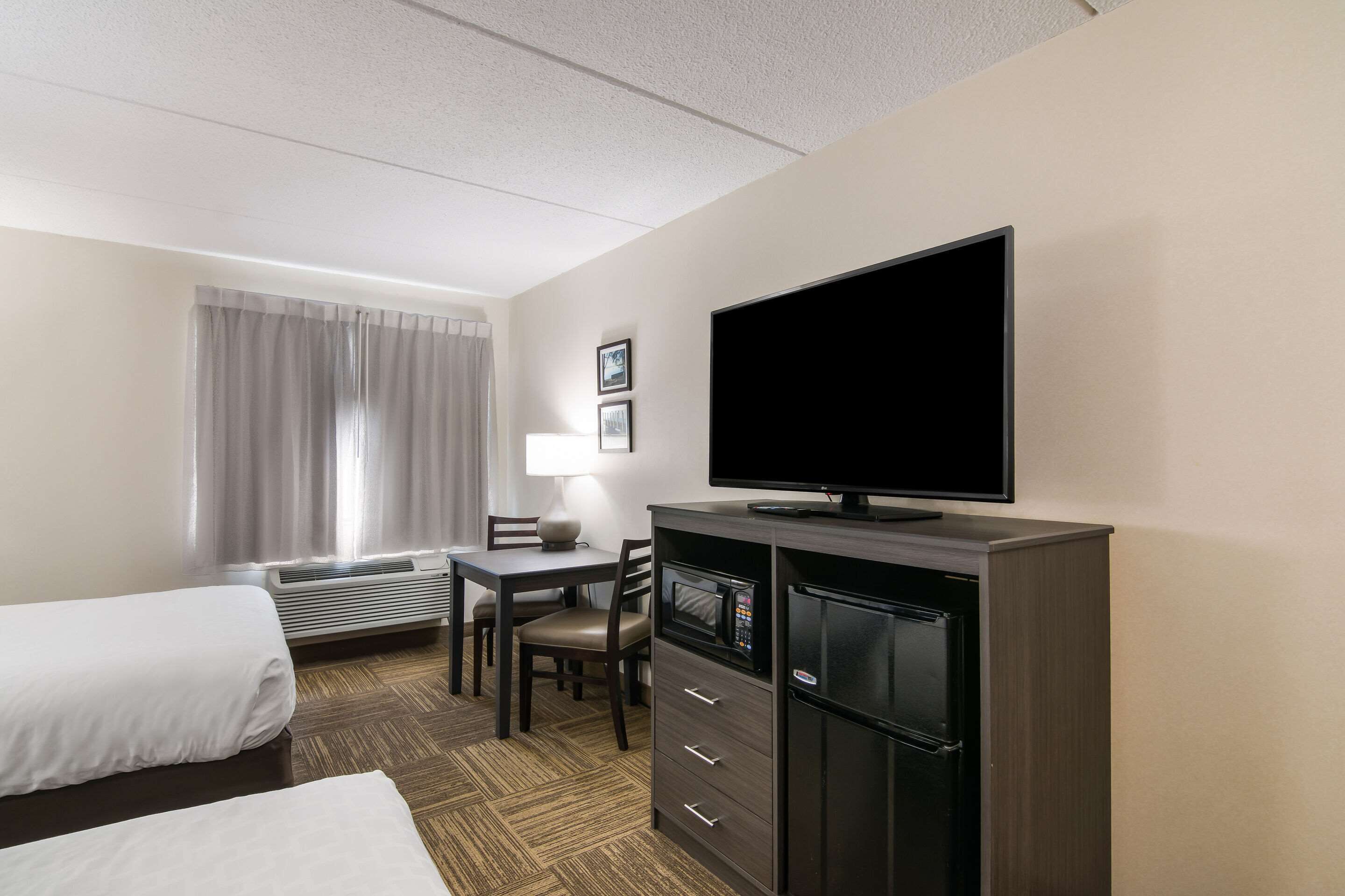 standard room, 2 queen beds, non smoking | in-room safe, desk, laptop workspace, iron/ironing board