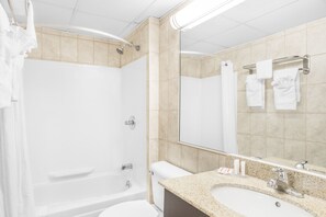 Combined shower/tub, designer toiletries, hair dryer, towels